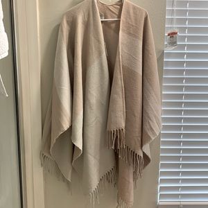 Brand new, never worn, one size fits all wrap. Retails at over $150.